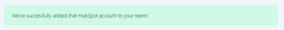Confirmation notification reading "We've successfully added that HubSpot account to your team!"